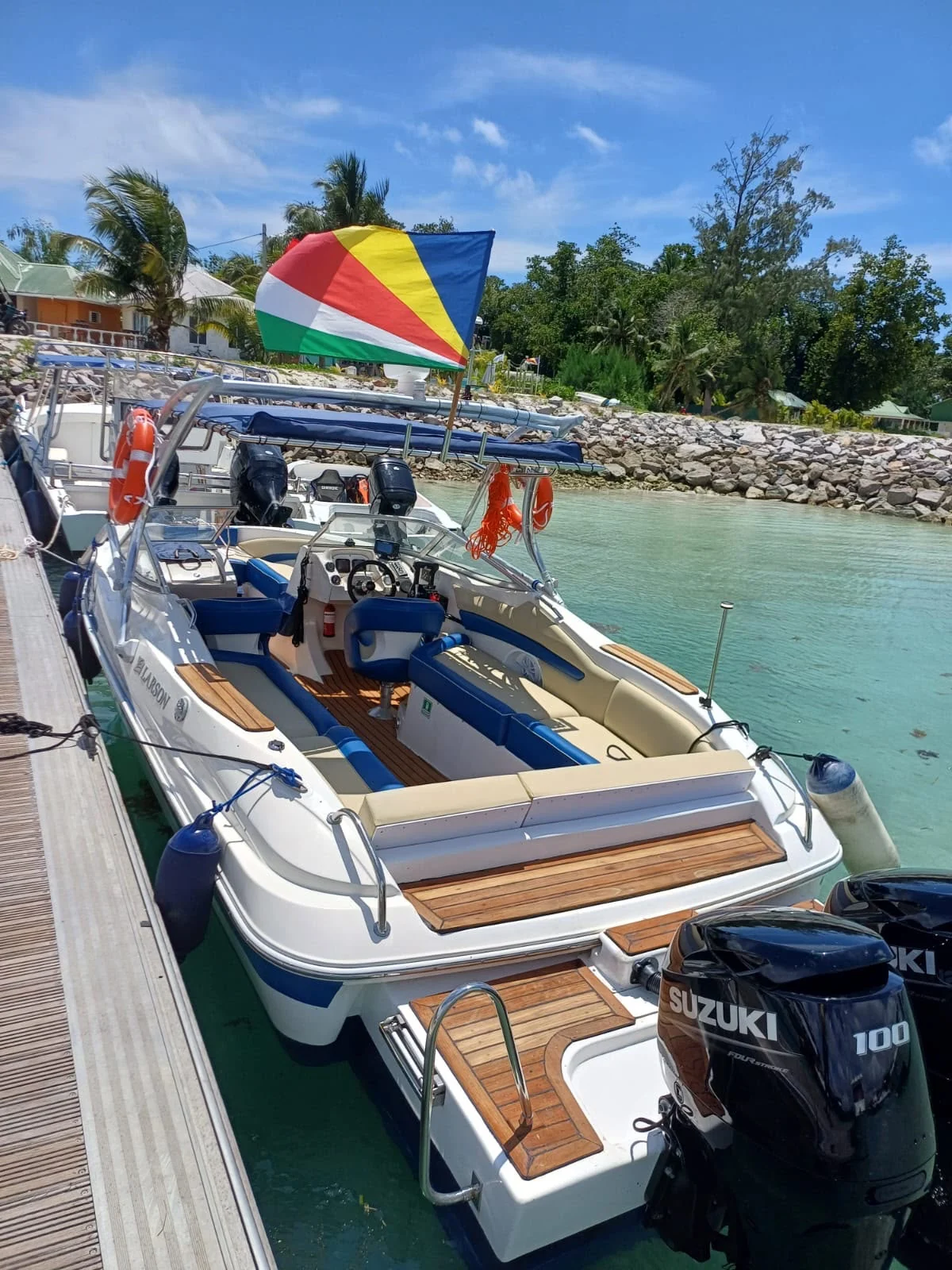 Blue-and-white boat seating at the dock — Actual photograph supplied by Footprint Charter