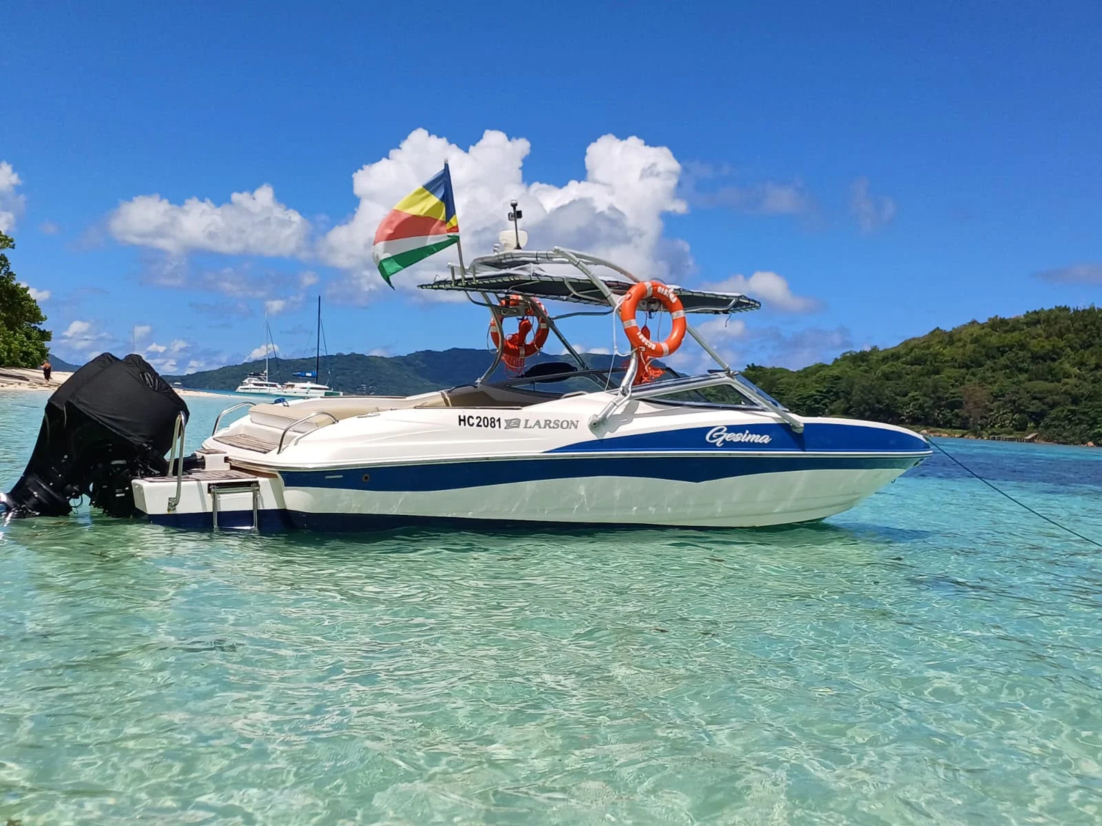 Boat at anchor in turquoise water — Actual photograph supplied by Footprint Charter